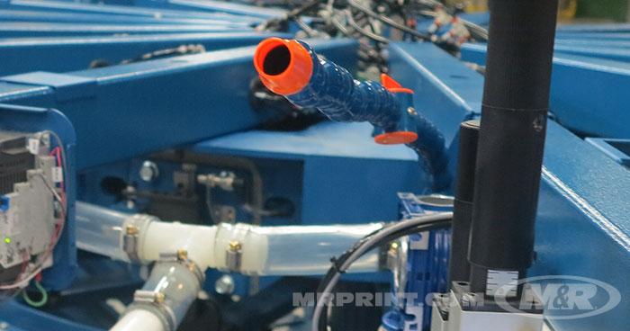 Adjustable delivery arms offer precise positioning